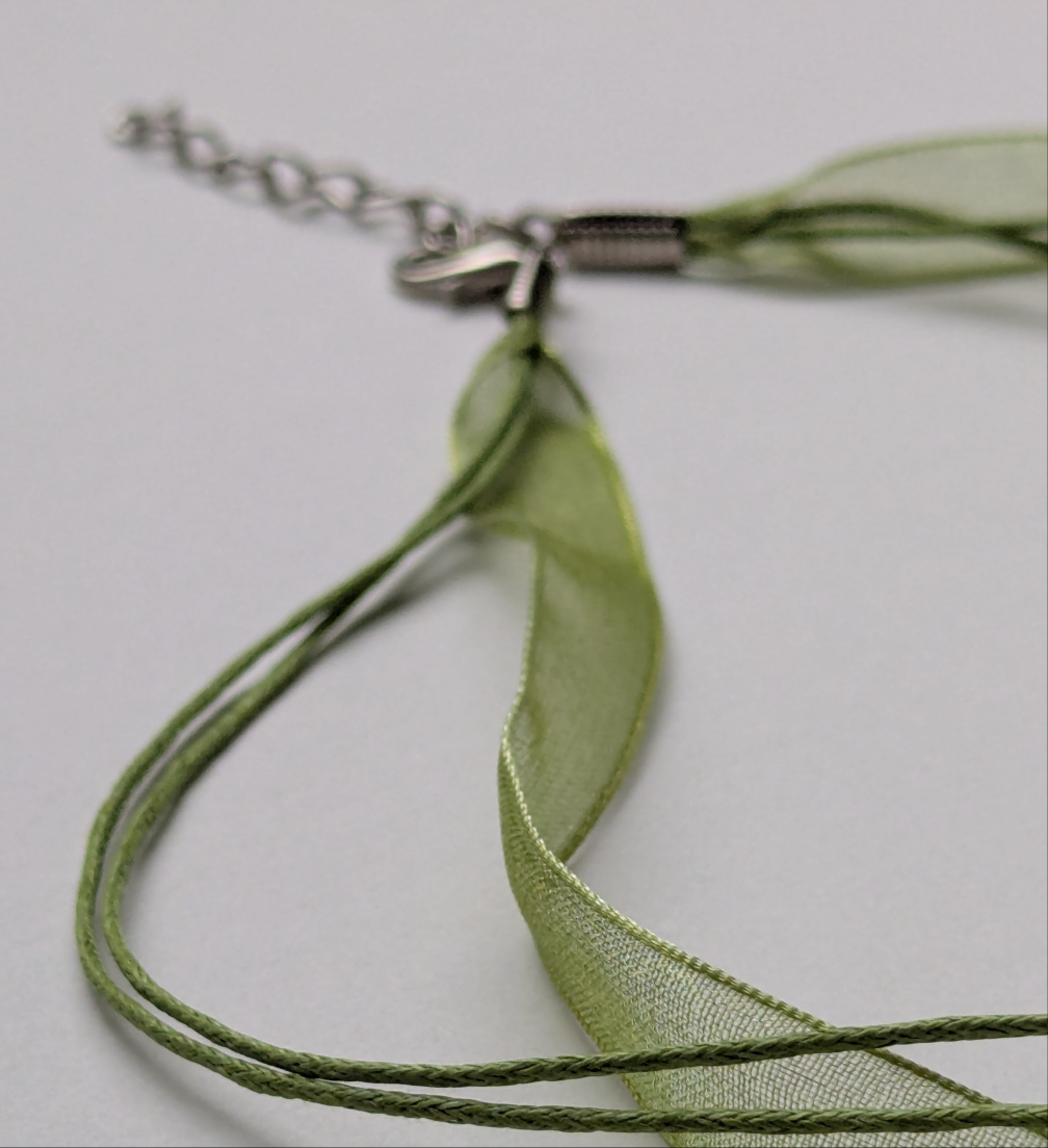 green cotton cord organza ribbon necklace with silver metallic clasp and adjustable chain