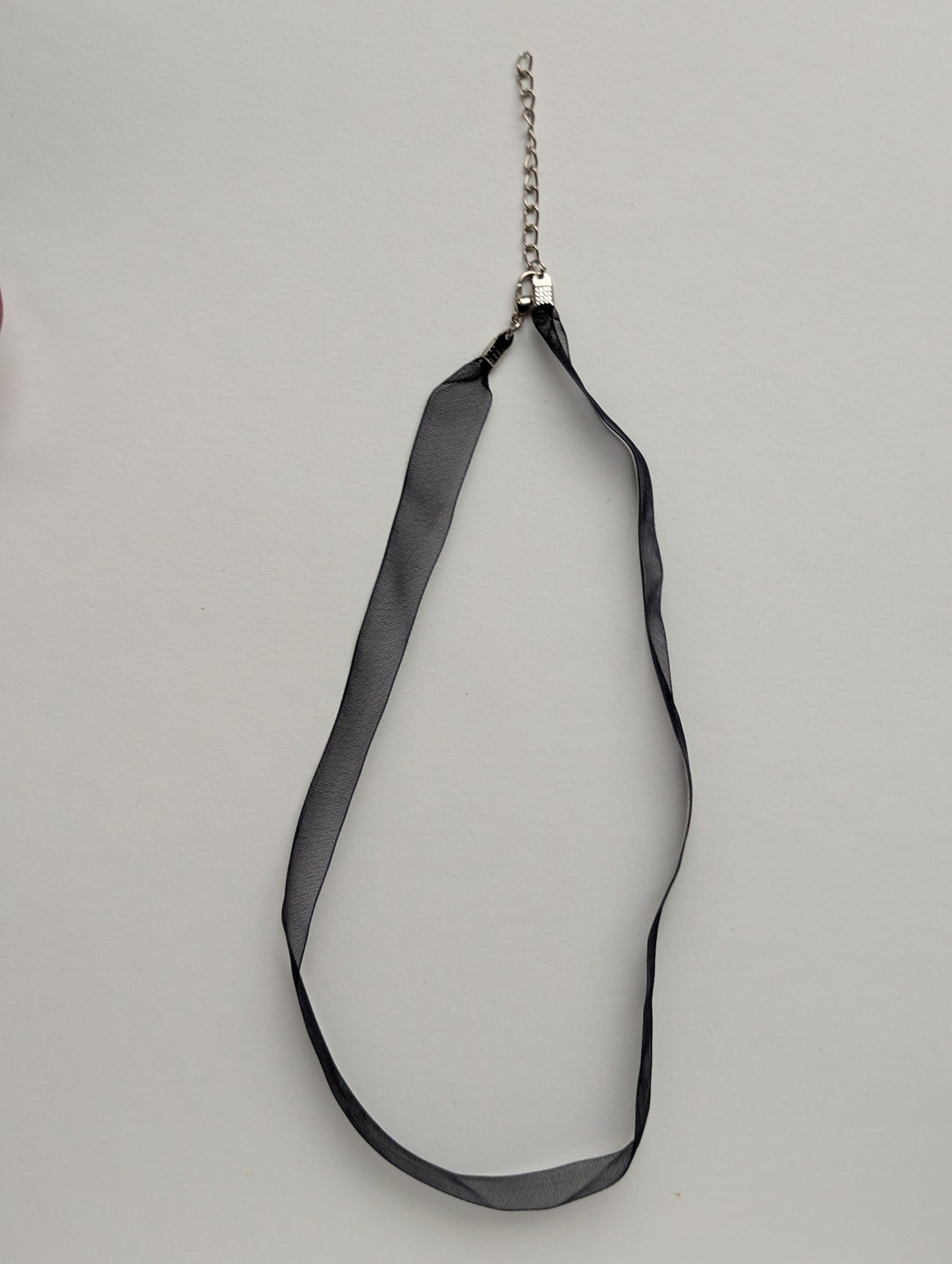 dark gray ribbon necklace with silver clasp and chain