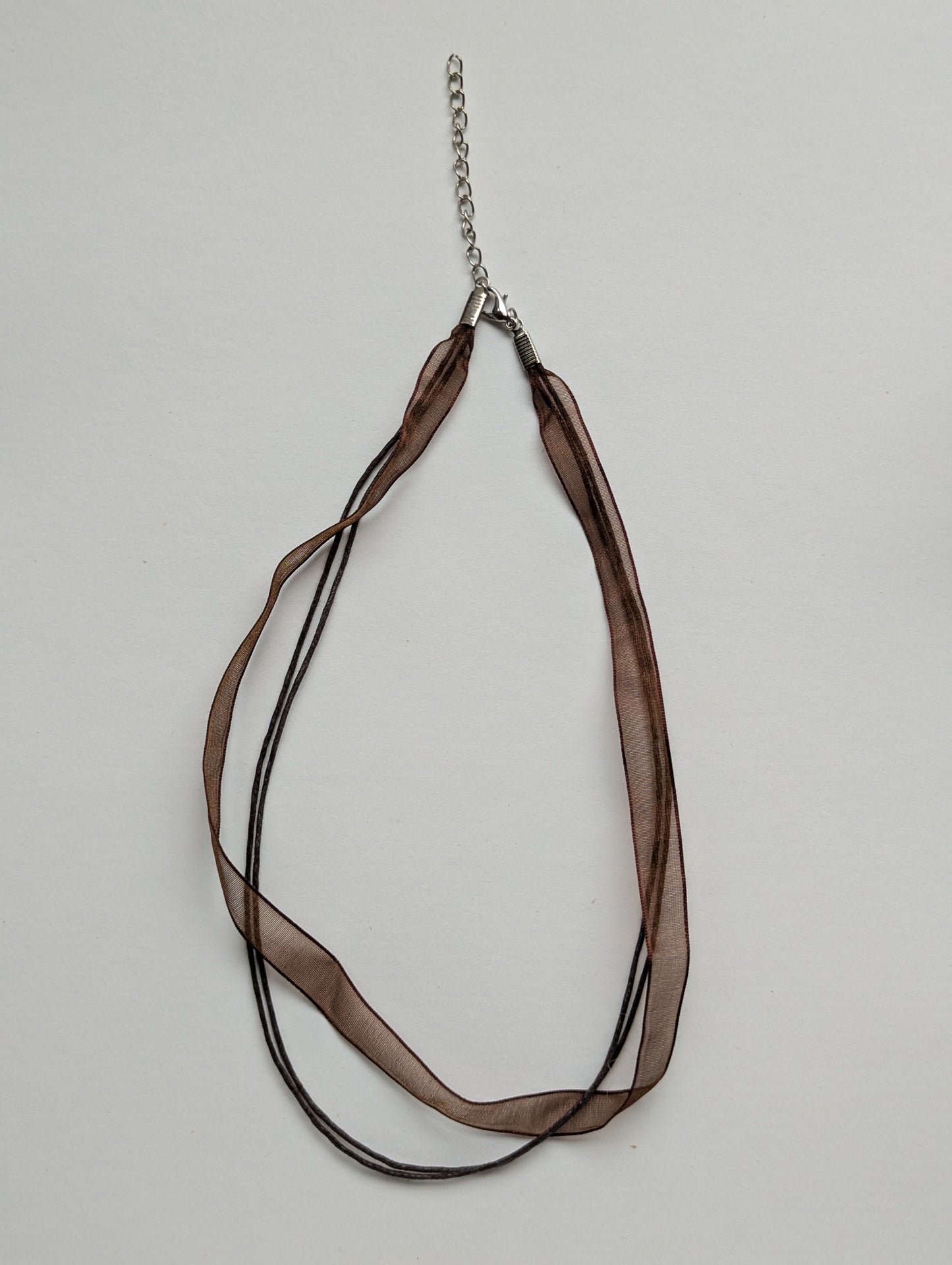 brown cotton cord organza ribbon necklace with silver metallic clasp and adjustable chain