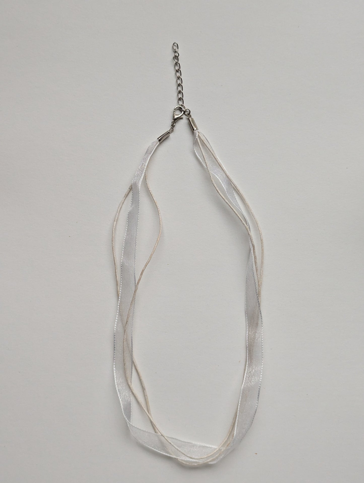 white cotton cord organza ribbon necklace with silver metallic clasp and adjustable chain