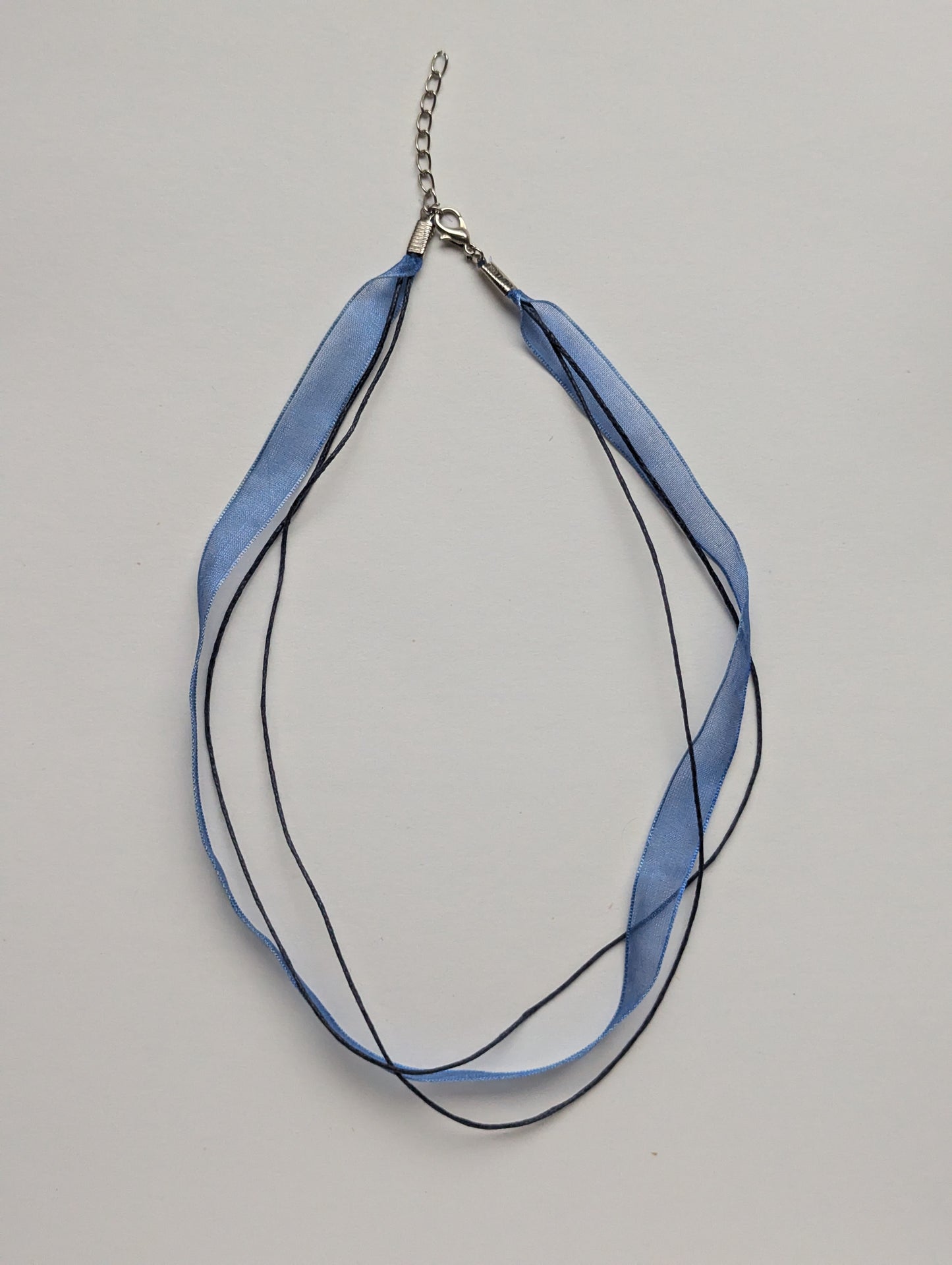 blue cotton cord organza ribbon necklace with silver metallic clasp and adjustable chain