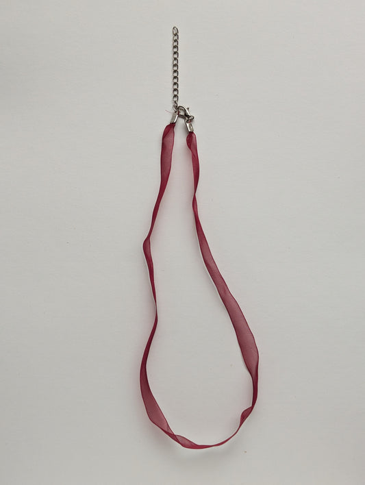 red ribbon necklace with silver clasp and adjustable chain