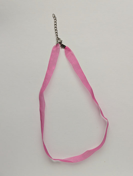 pink organza ribbon necklace with a silver-colored clasp and chain