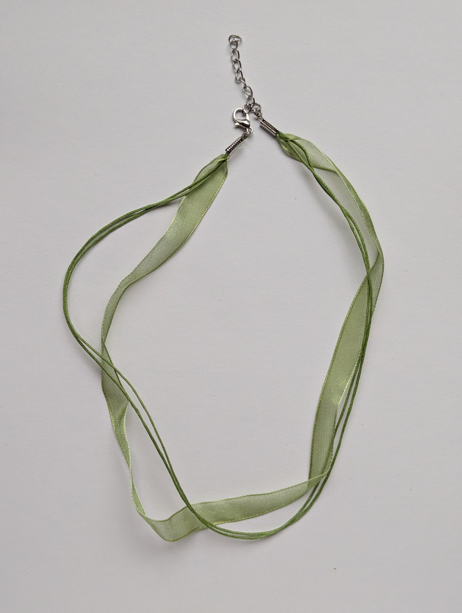 green cotton cord organza ribbon necklace with silver metallic clasp and adjustable chain