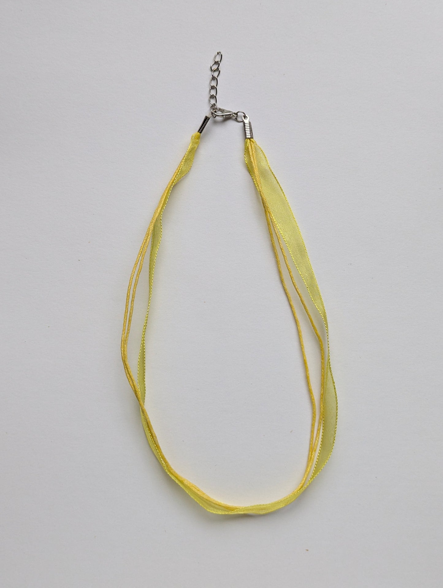yellow cotton cord organza ribbon necklace with silver metallic clasp and adjustable chain