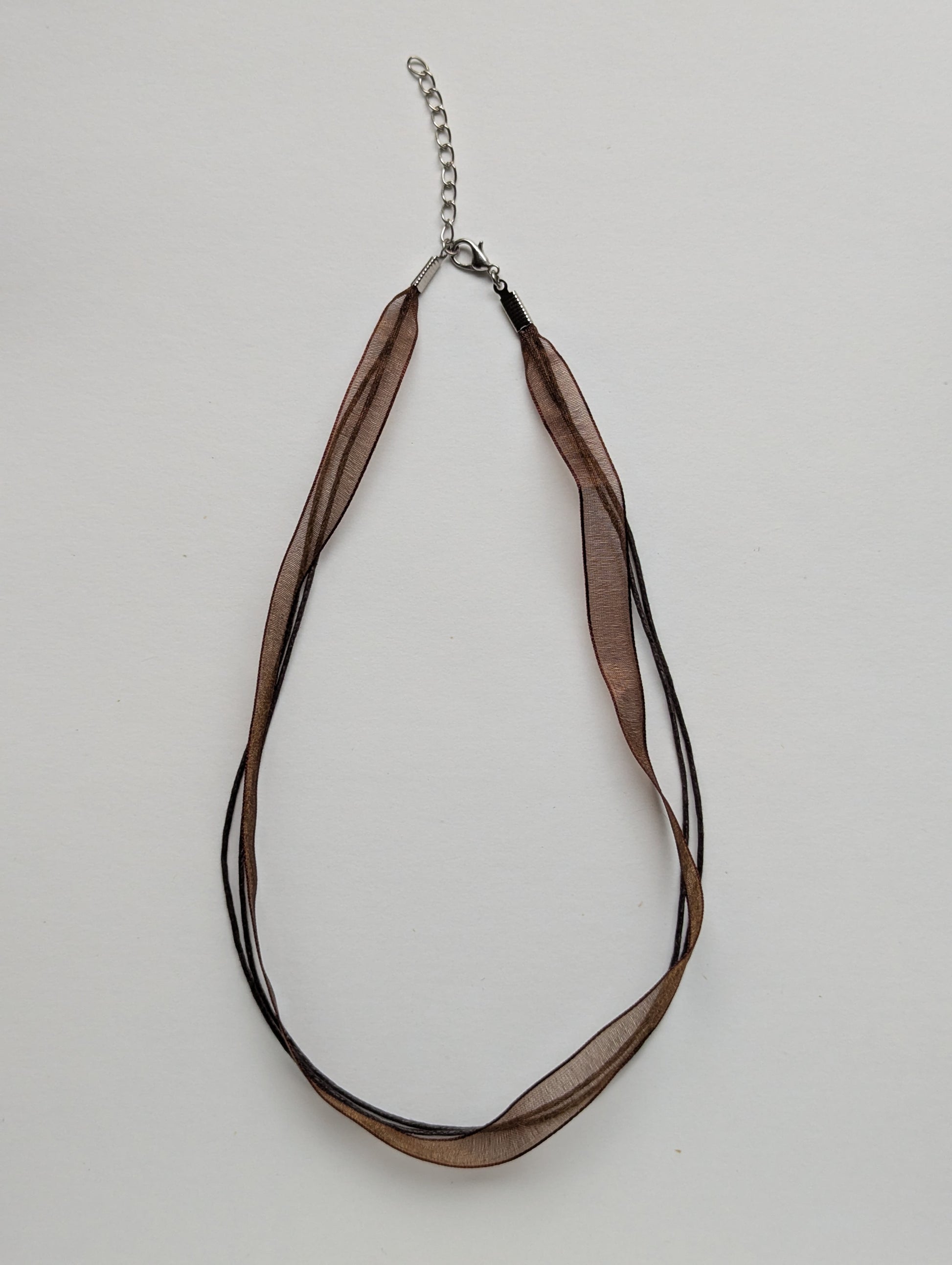 brown cotton cord organza ribbon necklace with silver metallic clasp and adjustable chain