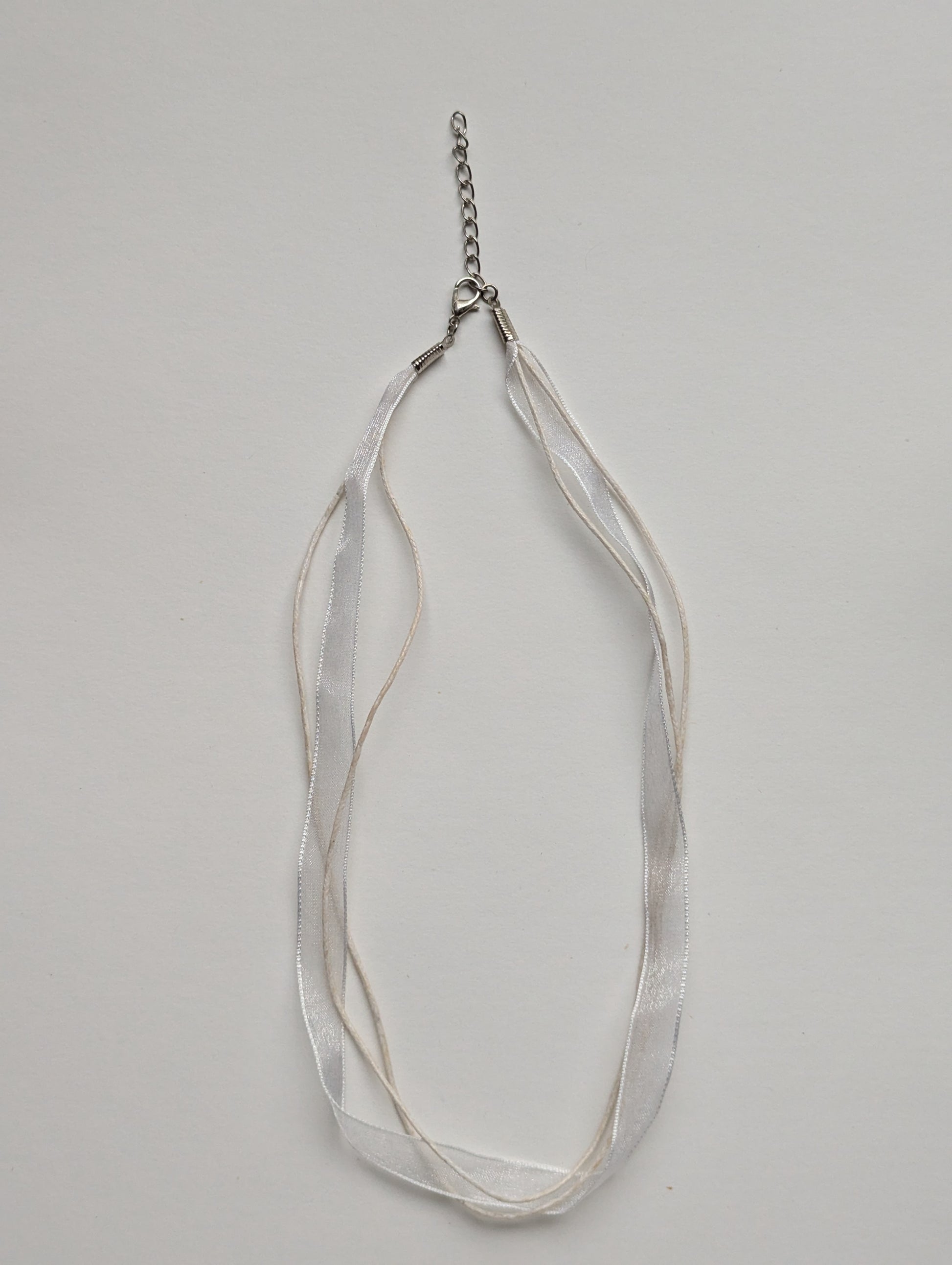 white cotton cord organza ribbon necklace with silver metallic clasp and adjustable chain